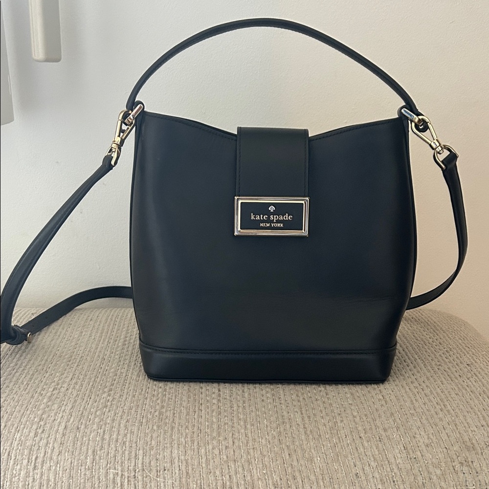 kate spade black leather bucket shoulder bag with gold-tone plaque